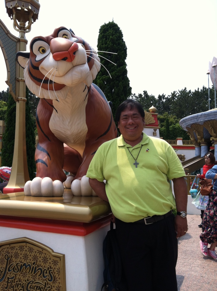Standing next to Rajah about to ride Jasmine's Flying Carpets